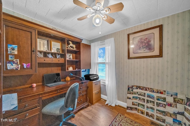 office featuring ceiling fan and light hardwood / wood-style floors