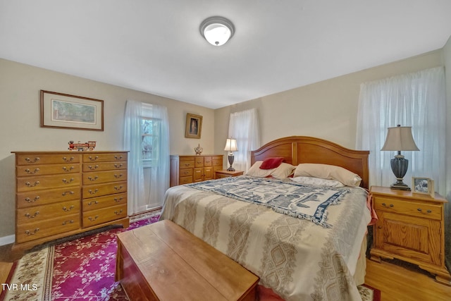 bedroom with hardwood / wood-style flooring