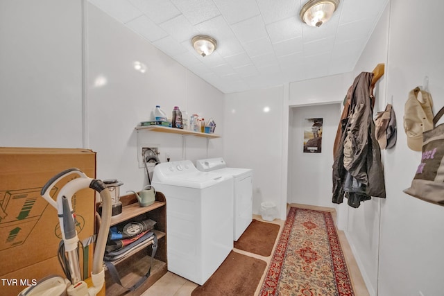 laundry area with washing machine and clothes dryer