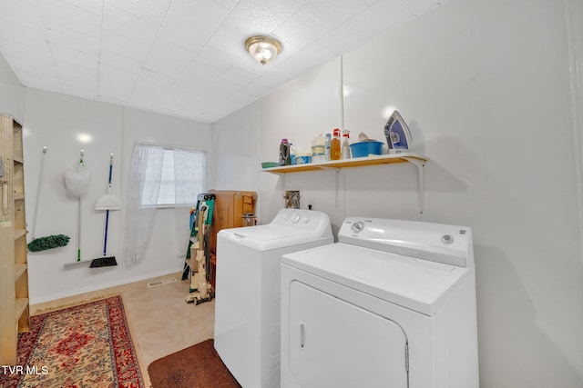 laundry room featuring washer and clothes dryer