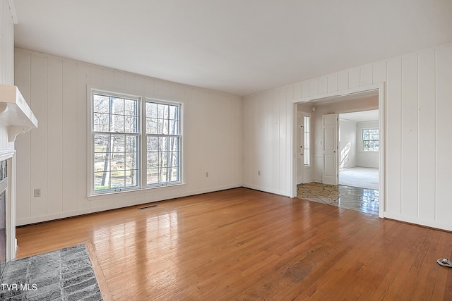 unfurnished living room featuring light hardwood / wood-style flooring