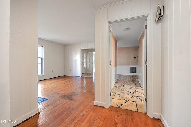 hall with hardwood / wood-style flooring