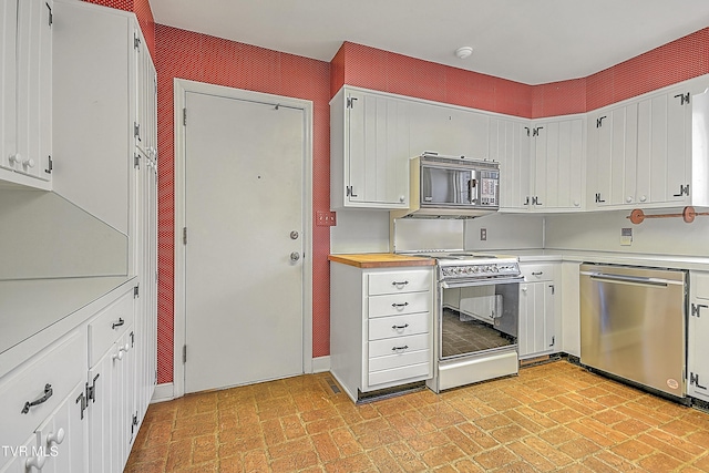 kitchen with white cabinets, stainless steel dishwasher, and electric range oven