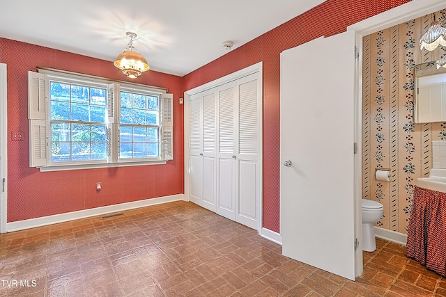 unfurnished bedroom featuring a closet