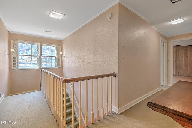 corridor with crown molding and light carpet