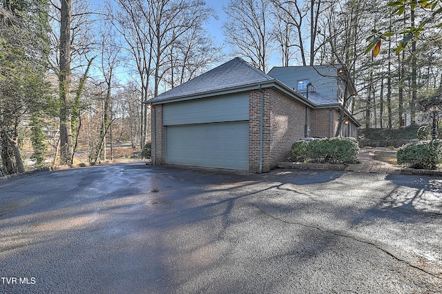 view of side of home with a garage