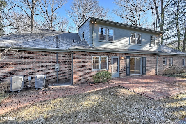 back of house with a patio and central AC unit