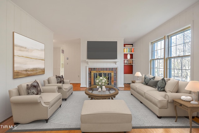 living room featuring crown molding and hardwood / wood-style floors