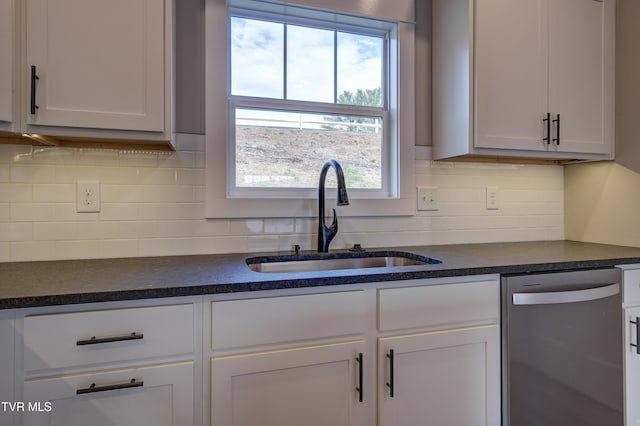 kitchen featuring white cabinets, dishwasher, backsplash, and sink