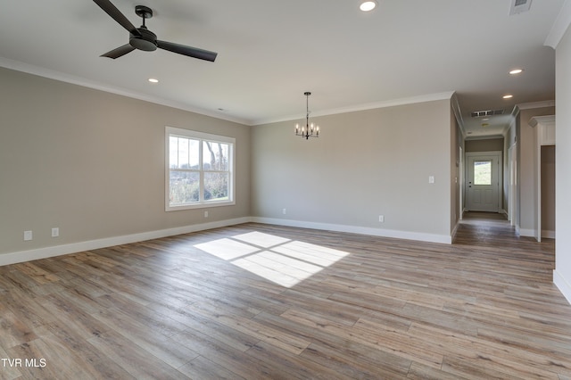 unfurnished room with ornamental molding, ceiling fan with notable chandelier, and light wood-type flooring