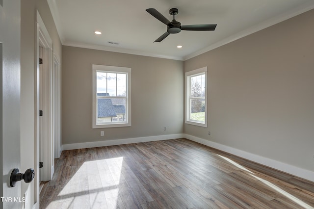 unfurnished bedroom featuring light hardwood / wood-style floors, ceiling fan, and crown molding