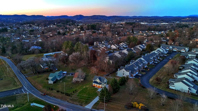 aerial view at dusk with a mountain view