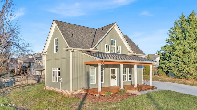 view of front of house with a front lawn and covered porch