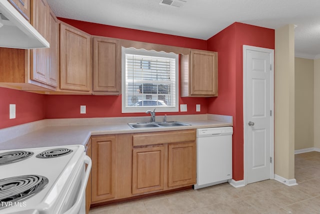 kitchen with a textured ceiling, light tile patterned flooring, white appliances, and sink