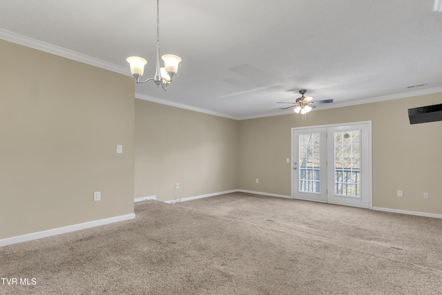 carpeted spare room with ceiling fan with notable chandelier and crown molding