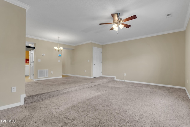 carpeted empty room featuring ceiling fan with notable chandelier and crown molding