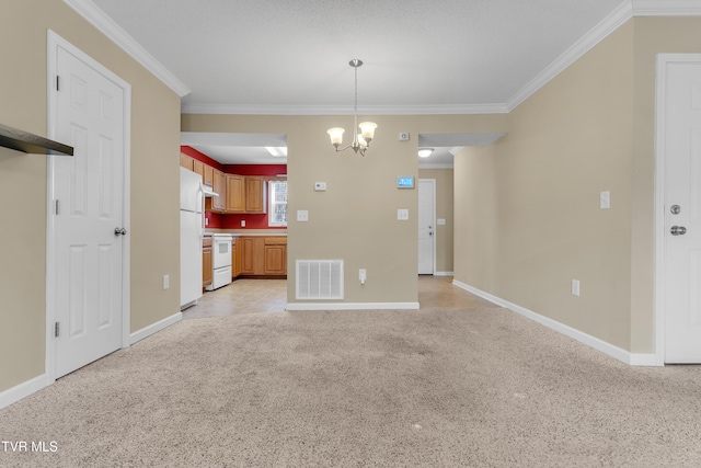 kitchen featuring a chandelier, pendant lighting, white appliances, and crown molding