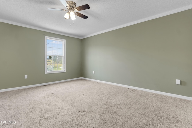 spare room featuring carpet flooring, ceiling fan, crown molding, and a textured ceiling