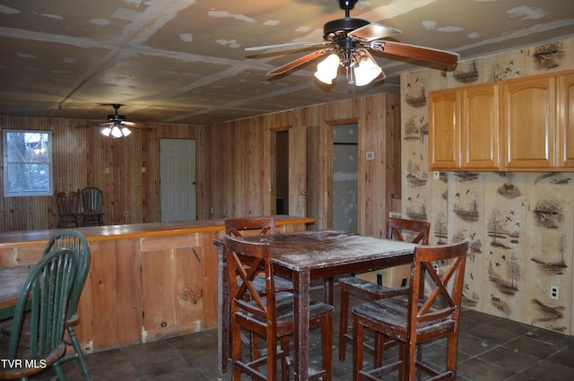 dining space with wood walls