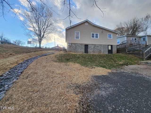 view of side of property with a wooden deck