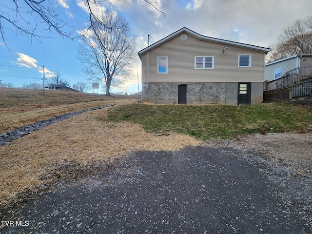 back of property featuring a deck