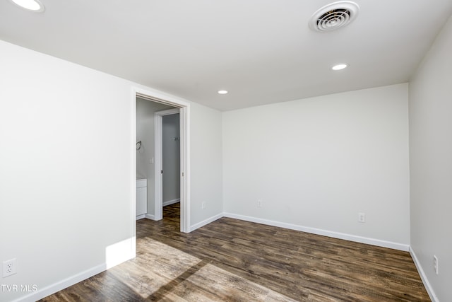 spare room featuring dark hardwood / wood-style floors