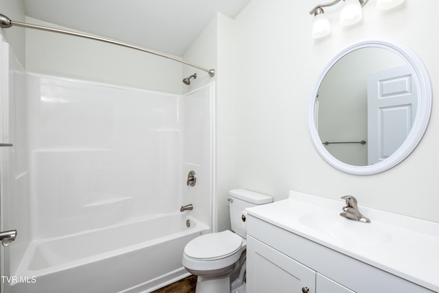 full bathroom featuring bathing tub / shower combination, vanity, and toilet