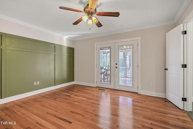 unfurnished bedroom with access to outside, french doors, ceiling fan, light wood-type flooring, and a textured ceiling