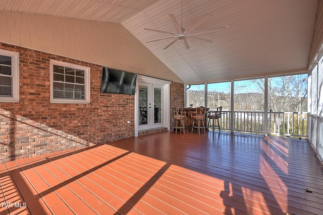 wooden terrace with ceiling fan and french doors