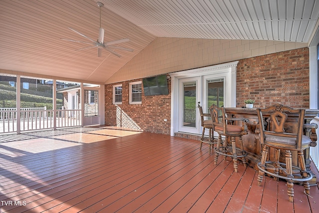 wooden deck featuring ceiling fan