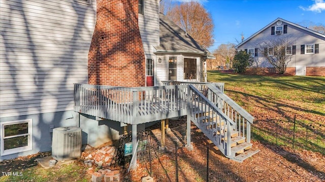 wooden deck with a lawn and central AC