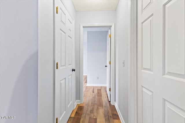 hall with dark hardwood / wood-style flooring