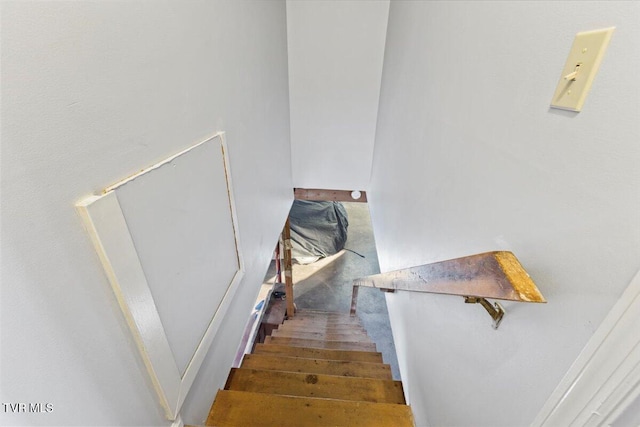 stairway featuring hardwood / wood-style flooring