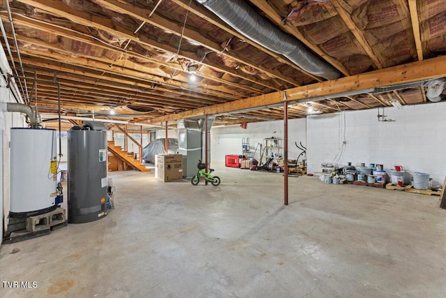 basement featuring heating unit and water heater