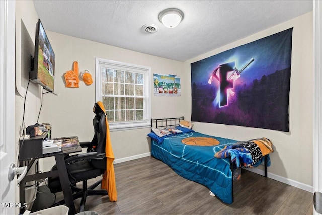 311 Dry Fork Rd, Del Rio, TN 37727 - bedroom featuring wood finished floors, a textured ceiling, and a desk