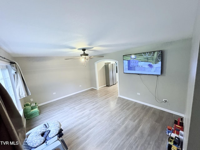 311 Dry Fork Rd, Del Rio, TN 37727 - unfurnished living room with ceiling fan, arched walkways, and wood finished floors