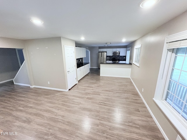 311 Dry Fork Rd, Del Rio, TN 37727 - unfurnished living room featuring light wood-style floors, plenty of natural light, and recessed lighting