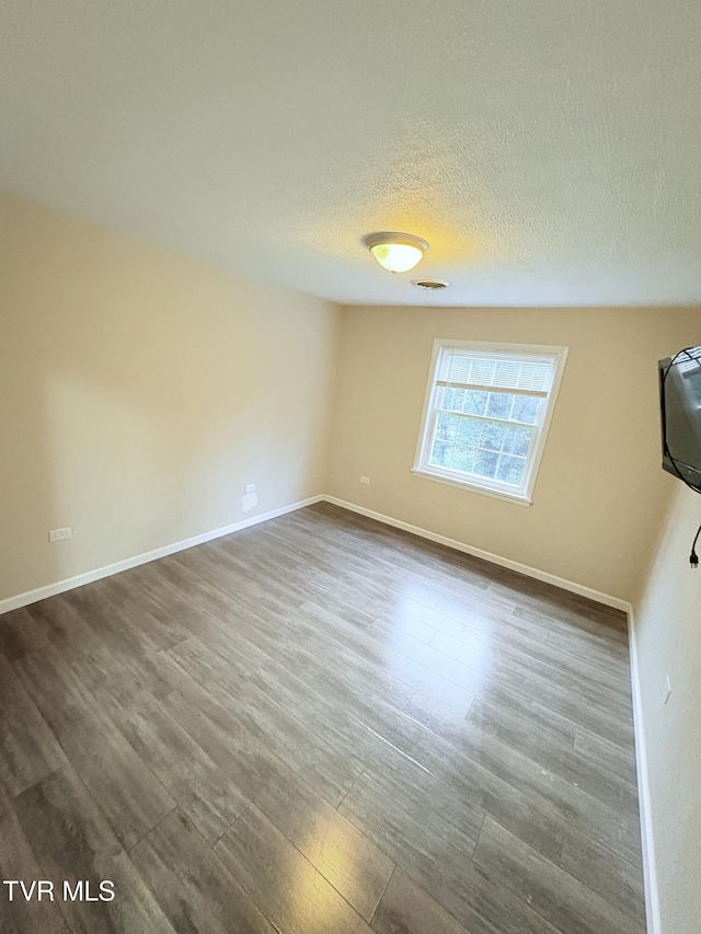 311 Dry Fork Rd, Del Rio, TN 37727 - empty room with dark wood-style flooring and a textured ceiling