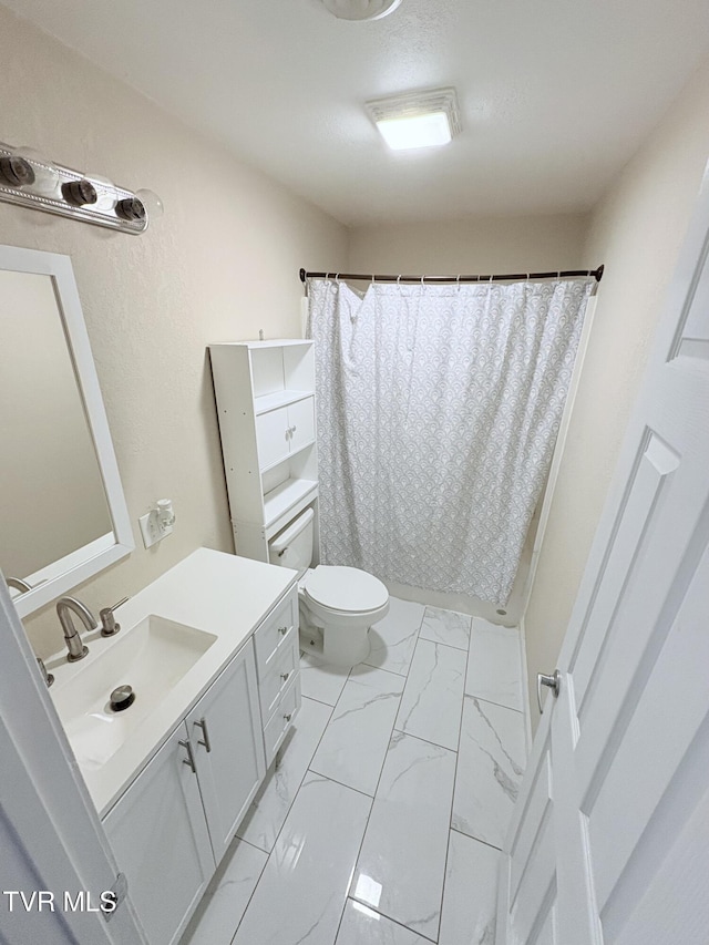 311 Dry Fork Rd, Del Rio, TN 37727 - bathroom featuring vanity, marble look tiles, and a shower with curtain
