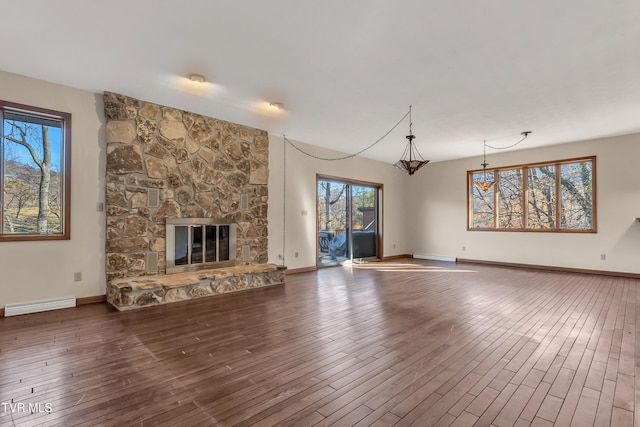 unfurnished living room with a fireplace and dark hardwood / wood-style floors