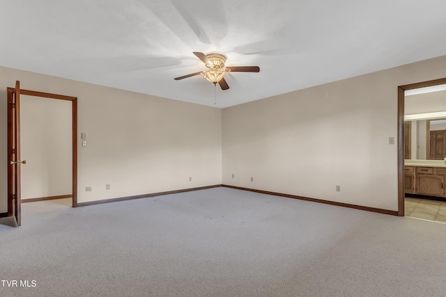 carpeted empty room with ceiling fan