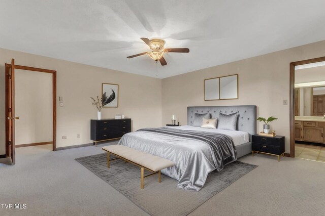 carpeted bedroom featuring connected bathroom and ceiling fan