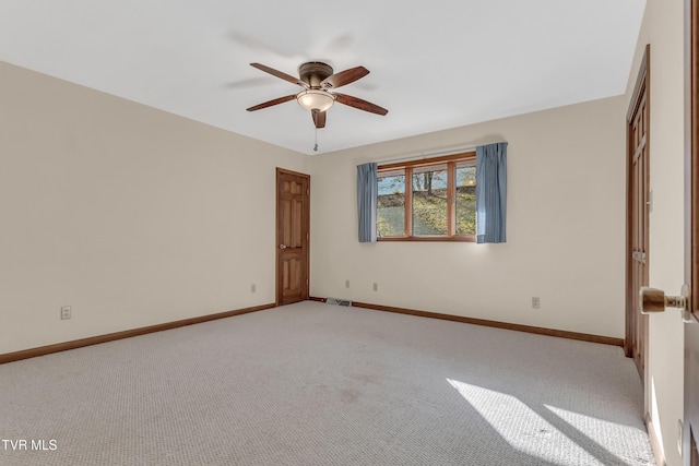 unfurnished bedroom featuring ceiling fan and light carpet