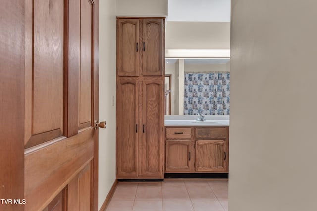 bathroom featuring tile patterned flooring, vanity, and a shower with shower curtain