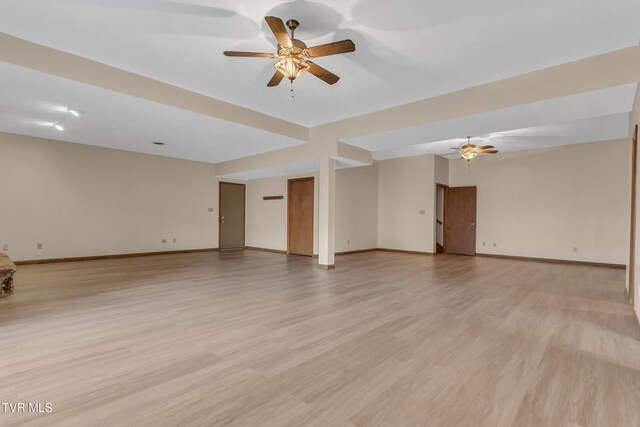 unfurnished room featuring ceiling fan and light hardwood / wood-style flooring