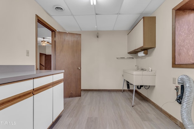 interior space with ceiling fan and light wood-type flooring