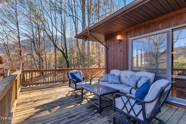 wooden deck with outdoor lounge area