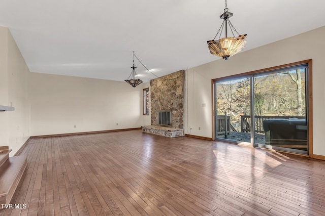 unfurnished living room featuring a fireplace and hardwood / wood-style floors