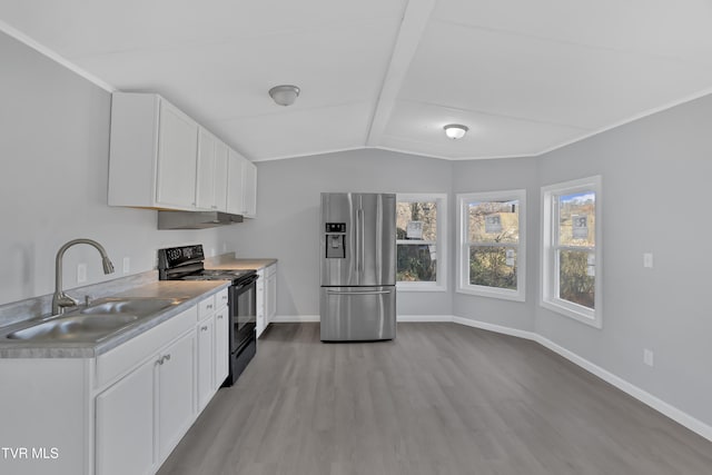 kitchen with sink, black / electric stove, stainless steel fridge, light hardwood / wood-style floors, and white cabinets