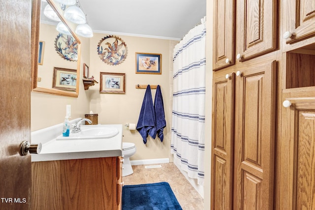 bathroom with vanity, crown molding, tile patterned flooring, toilet, and curtained shower